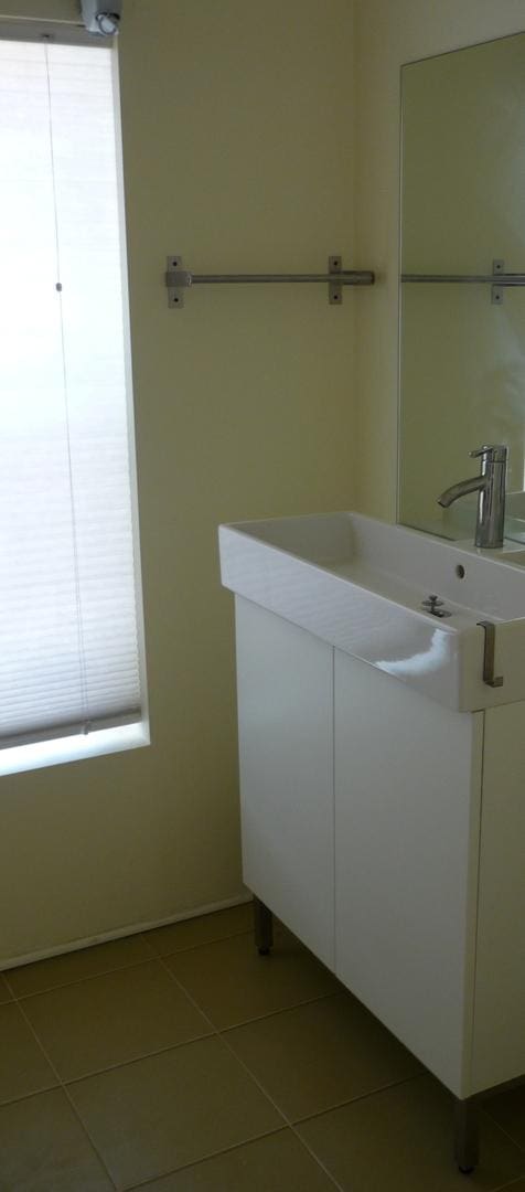 1926 W Grand Ave, Chicago, IL 60622 - bathroom featuring tile patterned floors, vanity, and baseboards