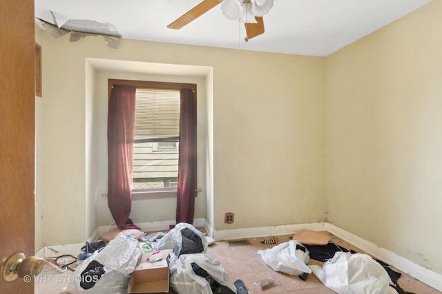 492 Freeland Ave, Calumet City, IL 60409 - spare room featuring a ceiling fan, baseboards, and tile patterned floors