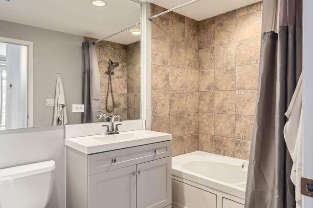 1405 N Orleans St Unit 5N, Chicago, IL 60610 - bathroom with vanity and shower / bath combination with curtain