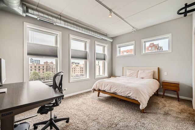 1405 N Orleans St Unit 5N, Chicago, IL 60610 - bedroom with track lighting, carpet floors, and an office area