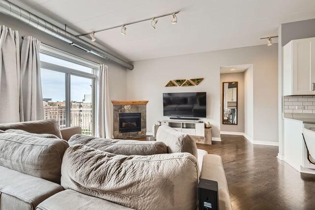 1405 N Orleans St Unit 5N, Chicago, IL 60610 - living area with rail lighting and a fireplace