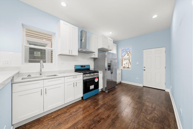 6728 S Sangamon St, Chicago, IL 60621 - kitchen with appliances with stainless steel finishes, wall chimney exhaust hood, a sink, white cabinetry, and dark wood-type flooring