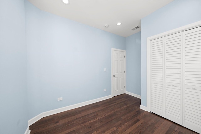 6728 S Sangamon St, Chicago, IL 60621 - unfurnished bedroom with dark wood-style flooring, baseboards, recessed lighting, and a closet