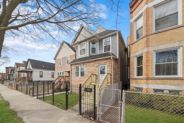 6728 S Sangamon St, Chicago, IL 60621 - view of front of house with a gate, a residential view, and stone siding