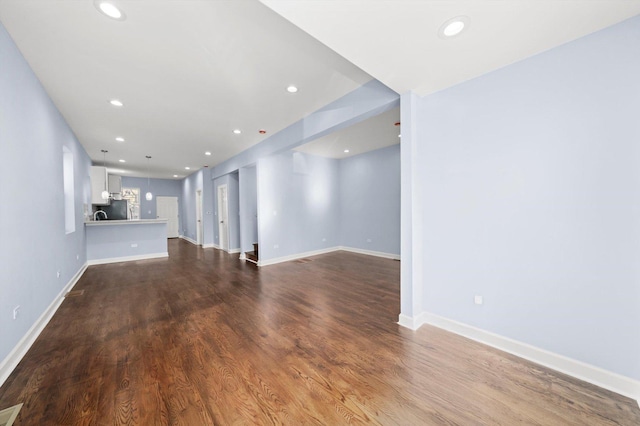 6728 S Sangamon St, Chicago, IL 60621 - unfurnished living room with recessed lighting, baseboards, and dark wood-style floors
