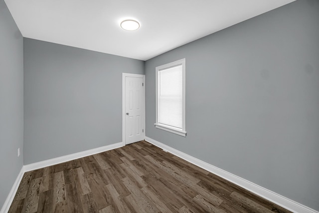 8623 S Wallace St, Chicago, IL 60620 - empty room featuring dark wood finished floors and baseboards