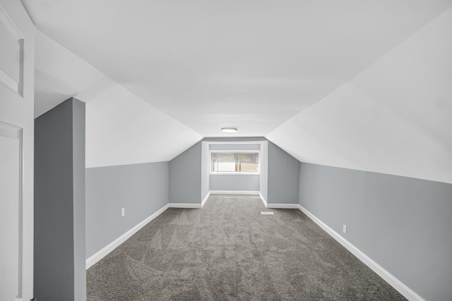 8623 S Wallace St, Chicago, IL 60620 - additional living space featuring carpet flooring, vaulted ceiling, and baseboards