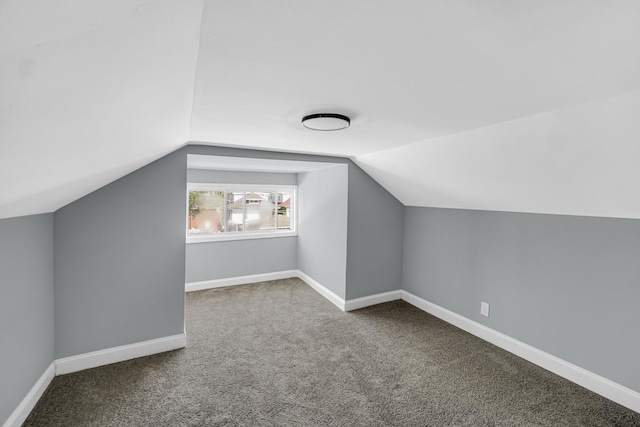 8623 S Wallace St, Chicago, IL 60620 - additional living space with carpet, vaulted ceiling, and baseboards