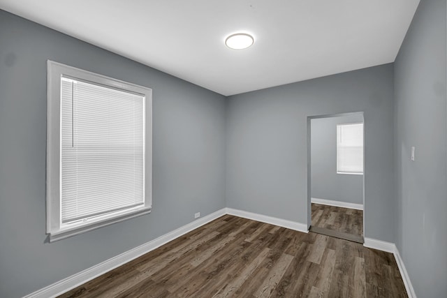 8623 S Wallace St, Chicago, IL 60620 - empty room featuring dark wood finished floors and baseboards