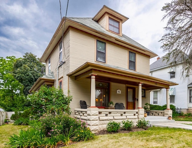 144 Hill Ave, Elgin, IL 60120 - traditional style home featuring covered porch