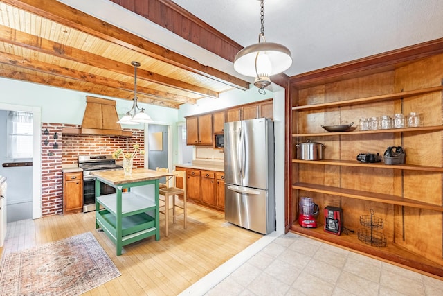 144 Hill Ave, Elgin, IL 60120 - kitchen featuring stainless steel appliances, custom range hood, open shelves, butcher block countertops, and brown cabinetry