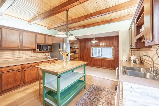144 Hill Ave, Elgin, IL 60120 - kitchen featuring open shelves, freestanding refrigerator, black microwave, wood walls, and a wood ceiling with exposed beams