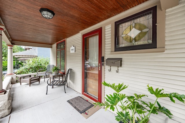 144 Hill Ave, Elgin, IL 60120 - doorway to property featuring covered porch