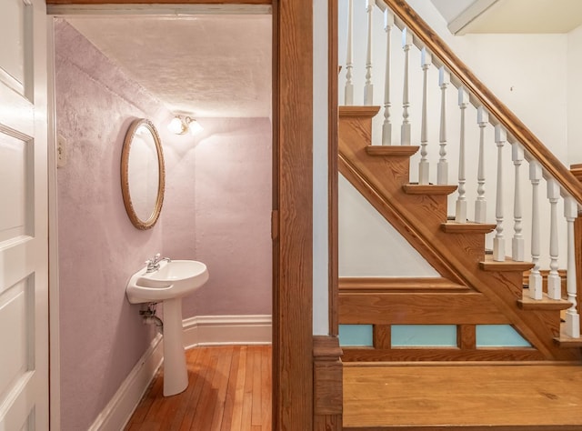 144 Hill Ave, Elgin, IL 60120 - stairway featuring hardwood / wood-style flooring and baseboards