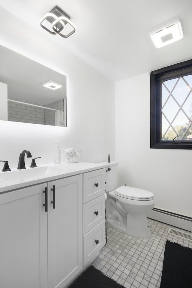 full bathroom featuring a baseboard radiator, toilet, vanity, tile patterned floors, and a shower