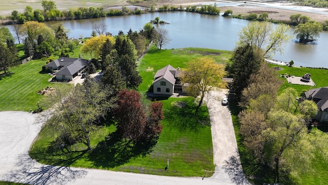 aerial view of property and surrounding area featuring a nearby body of water