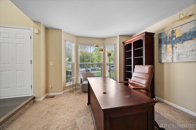 home office featuring light colored carpet and baseboards