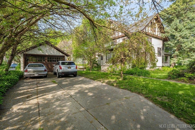view of property exterior featuring a detached garage