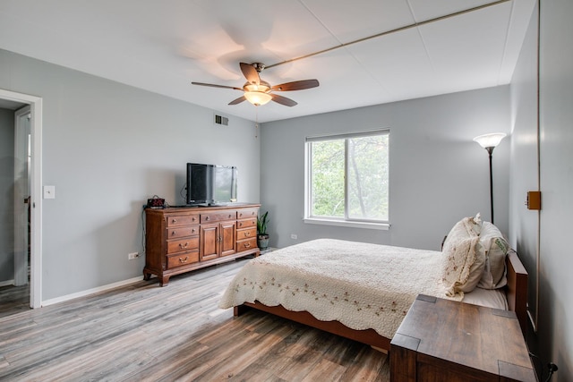 5S040 Pebblewood Ln Unit W503, Naperville, IL 60563 - bedroom with wood finished floors, baseboards, and ceiling fan