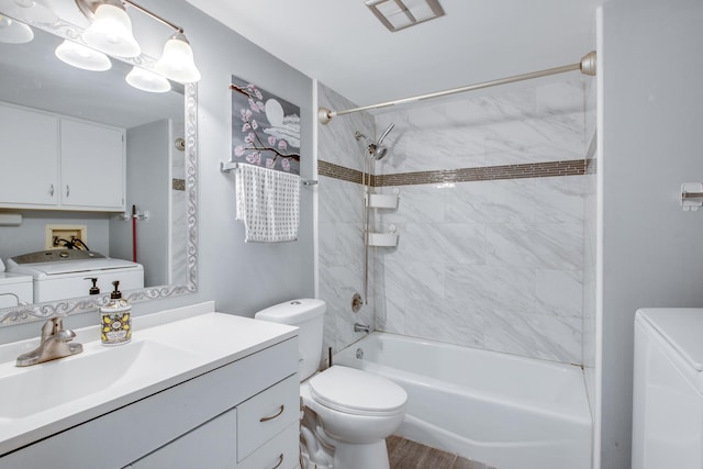 5S040 Pebblewood Ln Unit W503, Naperville, IL 60563 - bathroom featuring washing machine and clothes dryer, toilet, shower / bathtub combination, vanity, and wood finished floors