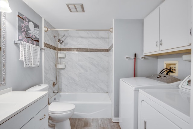5S040 Pebblewood Ln Unit W503, Naperville, IL 60563 - full bathroom featuring washer and clothes dryer, vanity, bathing tub / shower combination, toilet, and wood finished floors