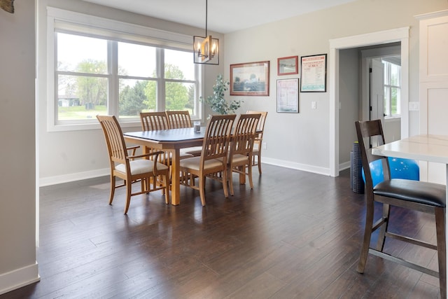 10499 E Shagbark Ln, Rochelle, IL 61068 - dining area featuring baseboards, healthy amount of natural light, and a chandelier