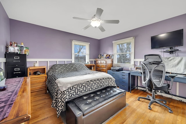 3019 Harris Dr, Joliet, IL 60431 - bedroom with hardwood / wood-style flooring, wainscoting, and a ceiling fan