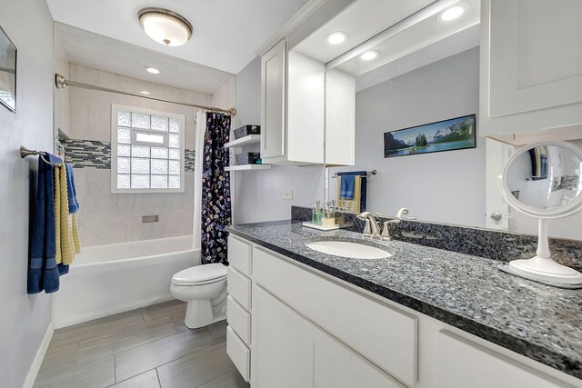 3019 Harris Dr, Joliet, IL 60431 - bathroom with toilet, shower / bath combo with shower curtain, vanity, recessed lighting, and baseboards