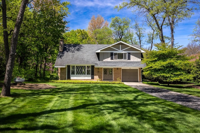 7N204 Eagle Ave, Medinah, IL 60157 - view of front of property with an attached garage, asphalt driveway, a chimney, and a front lawn