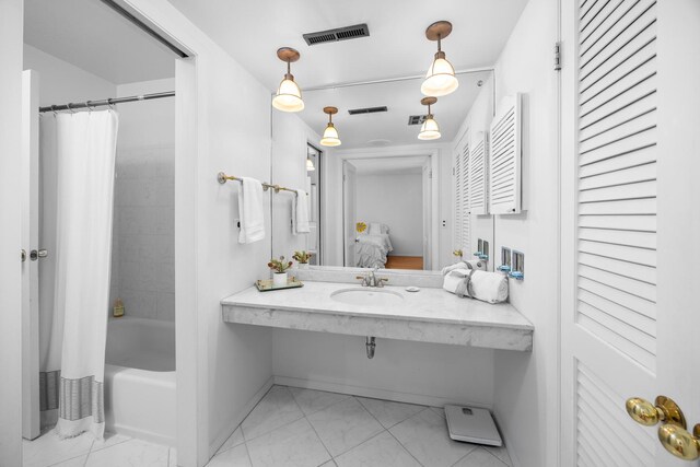 7N204 Eagle Ave, Medinah, IL 60157 - full bath with marble look tile flooring, connected bathroom, a sink, shower / bath combination with curtain, and baseboards