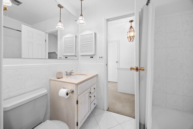 7N204 Eagle Ave, Medinah, IL 60157 - full bathroom featuring tile walls, toilet, vanity, tile patterned flooring, and shower / bathtub combination with curtain