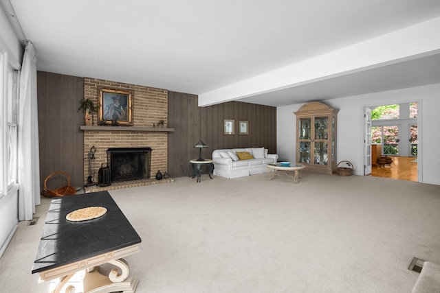 7N204 Eagle Ave, Medinah, IL 60157 - living area with carpet, wooden walls, a brick fireplace, and beam ceiling