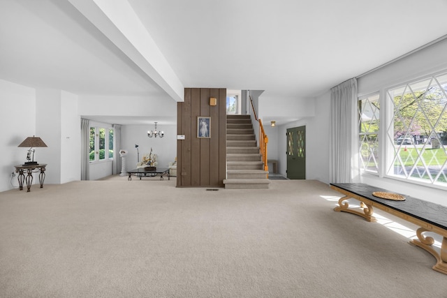 7N204 Eagle Ave, Medinah, IL 60157 - carpeted living room featuring stairs and a chandelier