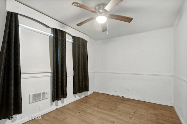 224 Shabbona Dr, Park Forest, IL 60466 - unfurnished room with wood finished floors, a ceiling fan, and baseboards