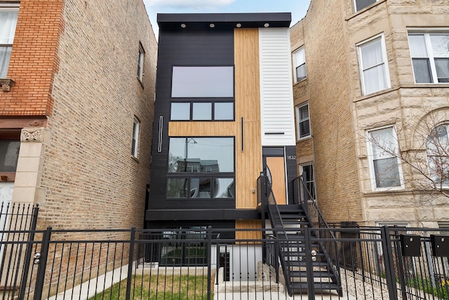 1832 N Kimball Ave, Chicago, IL 60647 - view of building exterior featuring a fenced front yard