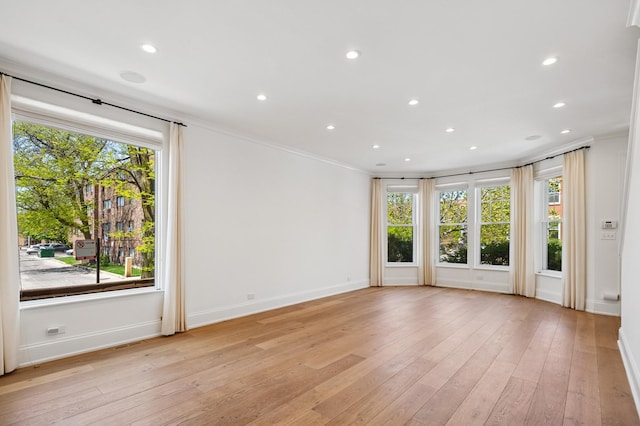 343 W Goethe St, Chicago, IL 60610 - empty room with baseboards, ornamental molding, light wood-style floors, and recessed lighting