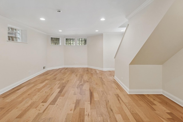 343 W Goethe St, Chicago, IL 60610 - basement featuring light wood-style floors, ornamental molding, recessed lighting, and baseboards