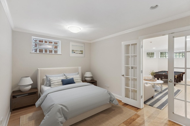 343 W Goethe St, Chicago, IL 60610 - bedroom featuring ornamental molding, light wood-style flooring, baseboards, and french doors