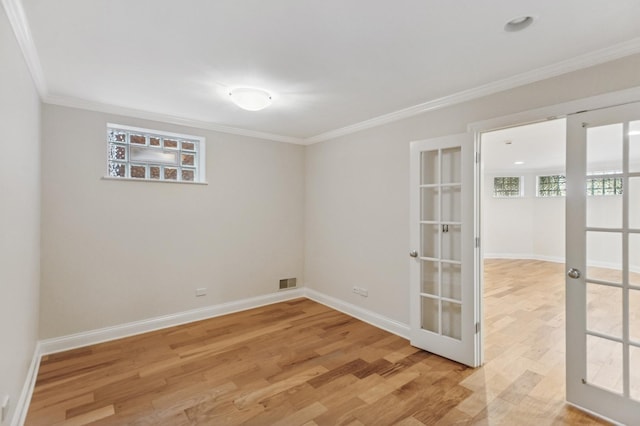 343 W Goethe St, Chicago, IL 60610 - spare room featuring light wood-type flooring, crown molding, and baseboards