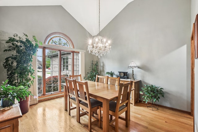 3840 W Nettle Creek Dr, Morris, IL 60450 - dining room featuring high vaulted ceiling, a chandelier, light wood finished floors, and baseboards