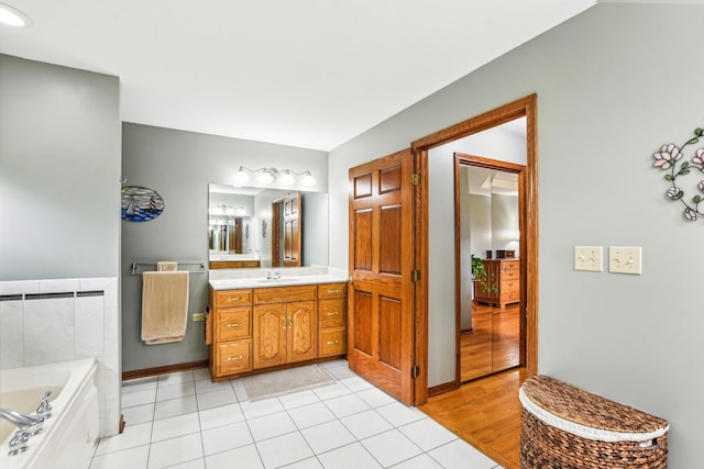 3840 W Nettle Creek Dr, Morris, IL 60450 - full bath featuring a garden tub, tile patterned flooring, vanity, and baseboards