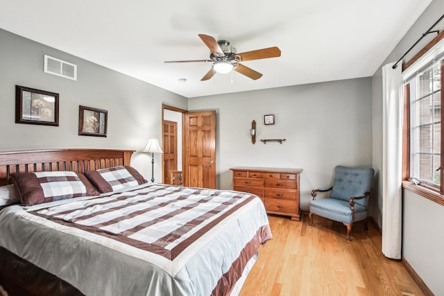 3840 W Nettle Creek Dr, Morris, IL 60450 - bedroom with light wood finished floors and ceiling fan