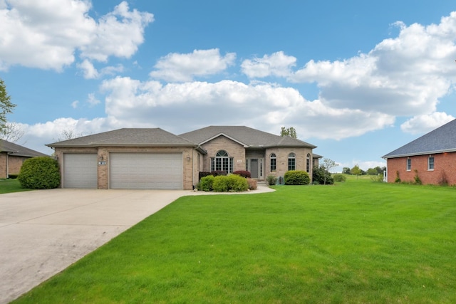 3840 W Nettle Creek Dr, Morris, IL 60450 - view of front of property with a garage, driveway, a front lawn, and brick siding
