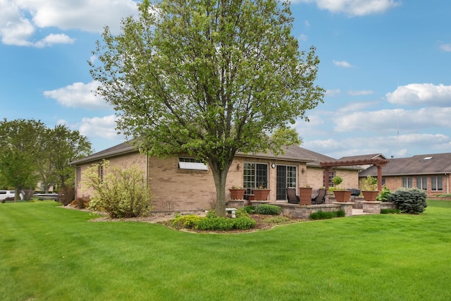 3840 W Nettle Creek Dr, Morris, IL 60450 - rear view of house featuring brick siding, a yard, and a patio area