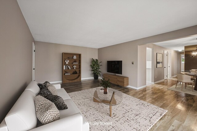 5327 N Delphia Ave Unit 327, Chicago, IL 60656 - living area with wood finished floors and a chandelier