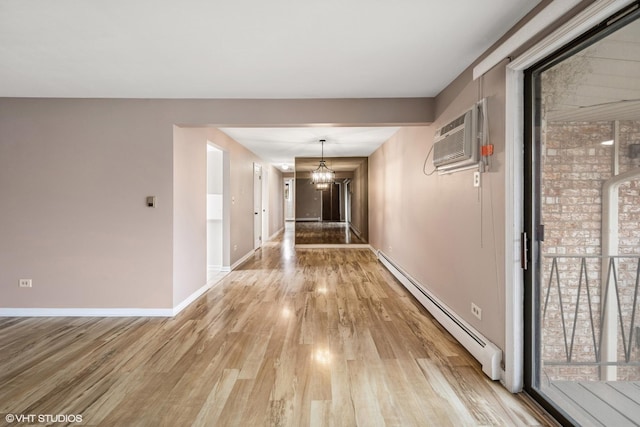 5327 N Delphia Ave Unit 327, Chicago, IL 60656 - hall featuring a baseboard radiator, light wood-style floors, and a wall mounted air conditioner