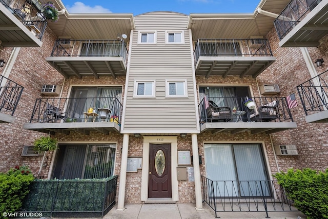 5327 N Delphia Ave Unit 327, Chicago, IL 60656 - view of building exterior with an AC wall unit