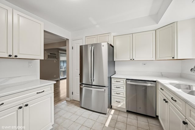 5327 N Delphia Ave Unit 327, Chicago, IL 60656 - kitchen with stainless steel appliances, white cabinets, light stone countertops, and light tile patterned floors