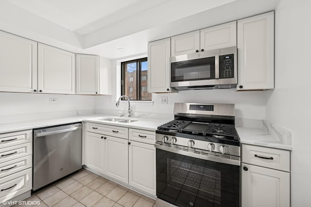 5327 N Delphia Ave Unit 327, Chicago, IL 60656 - kitchen with stainless steel appliances, white cabinets, light tile patterned floors, and light stone counters