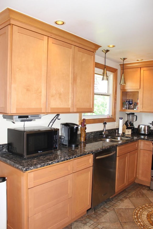 kitchen with dishwashing machine, stainless steel microwave, a sink, pendant lighting, and dark stone countertops